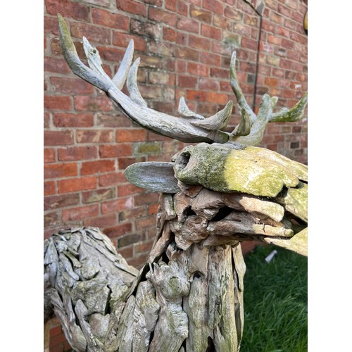 1362 - A pair of large driftwood art deer figures. 145cm h to antler x 130cm l approx.