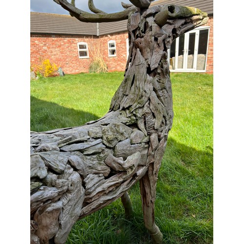 1362 - A pair of large driftwood art deer figures. 145cm h to antler x 130cm l approx.