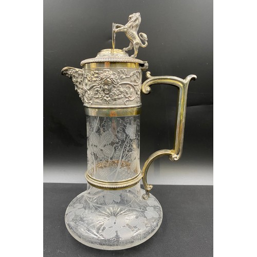 523 - A Victorian 1886 Elkington & Co silver plated glass claret jug with etched grapevine decoration and ... 