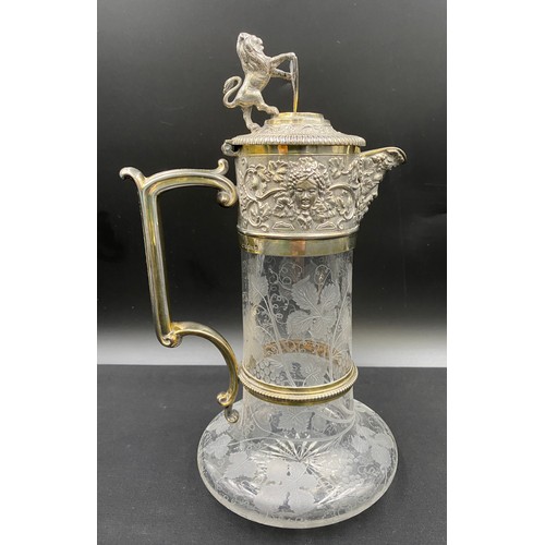 523 - A Victorian 1886 Elkington & Co silver plated glass claret jug with etched grapevine decoration and ... 