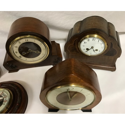 836 - A collection of 4 mid 20thC mantle clocks, 2 by Smiths of Great Britain together with a round wooden... 