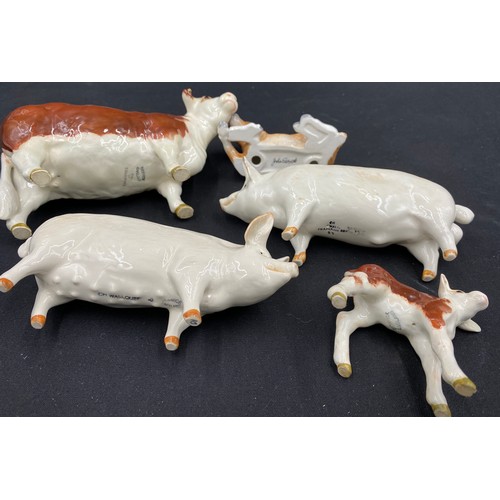 83 - Five Beswick animal figures comprising; 2 pigs, a Champion Wall Queen 40 and a Champion Wall Boy 53;... 