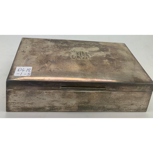 550 - A silver cigarette box London 1970. Initialled to top and dated 8.10.71. 17.5 x 10cm. Weight 553.2gm... 