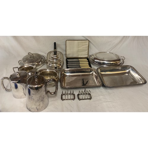 524 - A quantity of silver-plate to include tea service, toast racks, entrée dishes etc.