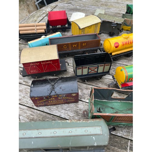 717 - A collection of vintage tinplate railway carriages.