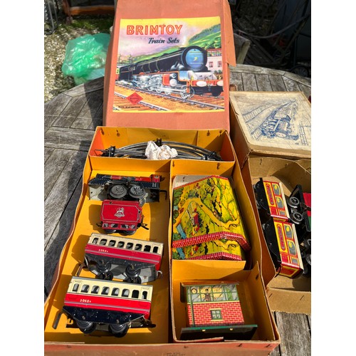 732 - Three Vintage train sets to include Brimtoy etc.