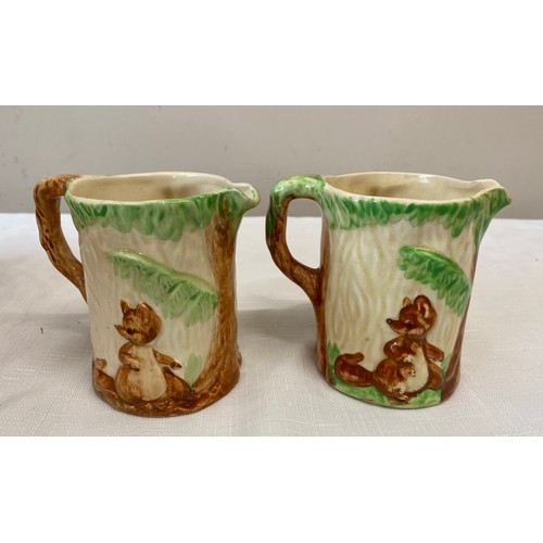 97 - Two Wadeheath 'Walt Disney' jugs relief moulded with dwarves  9cm h together with 2 mouse figurines ... 