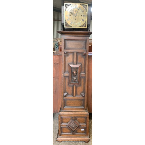 838 - A Maple of London carved oak longcase clock, with three train movement and Westminster chime.