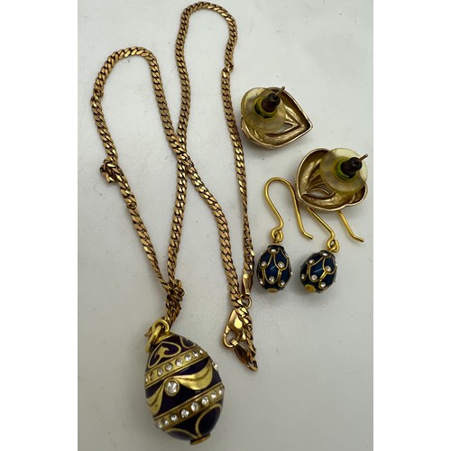 361 - A 9ct gold chain with enamel egg pendant, enamel egg earrings and leaf earrings with 9ct posts.