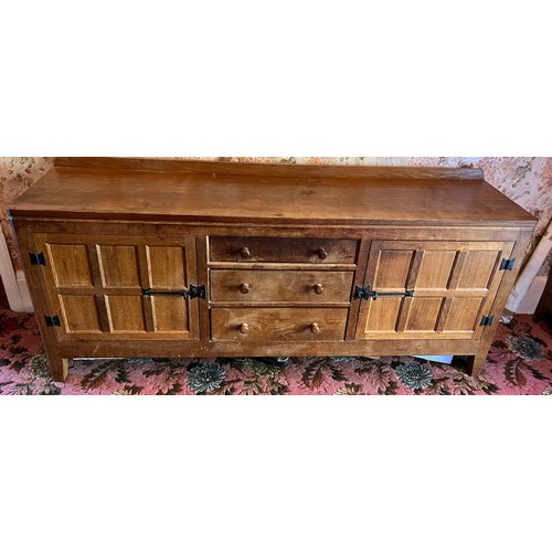 785B - Peter Heap Rabbitman, An Oak Panelled Sideboard, with raised upstand above two cupboard doors enclos... 