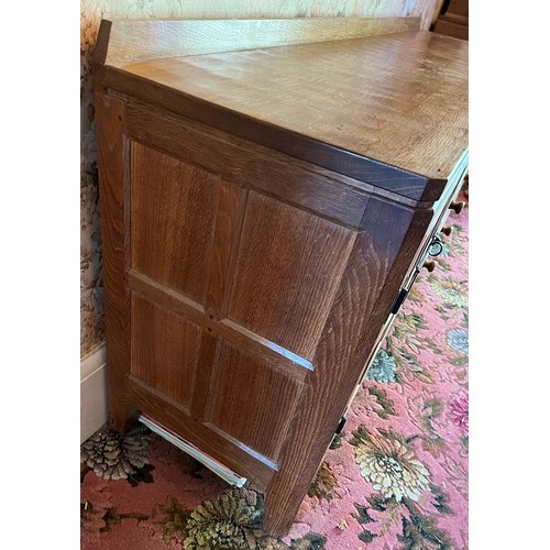 785B - Peter Heap Rabbitman, An Oak Panelled Sideboard, with raised upstand above two cupboard doors enclos... 