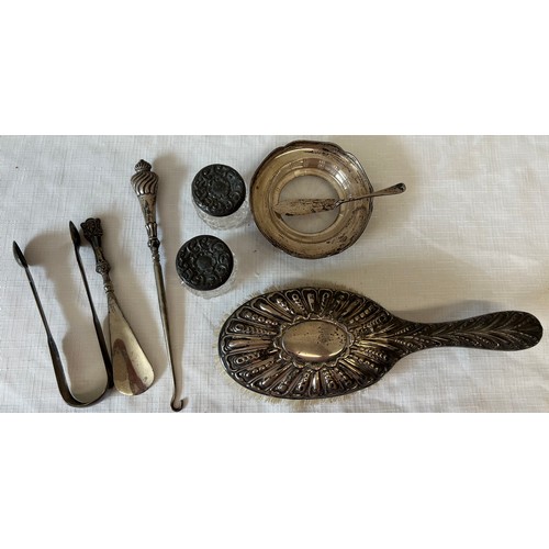 560 - Various items of silver to include lidded glass pots, hair brush, butter dish, button hook and Georg... 