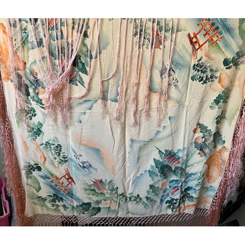 500 - A Chinese silk shawl depicting pagodas and landscapes. 124cm square excluding tassels.