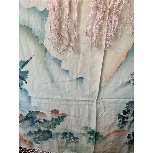 500 - A Chinese silk shawl depicting pagodas and landscapes. 124cm square excluding tassels.