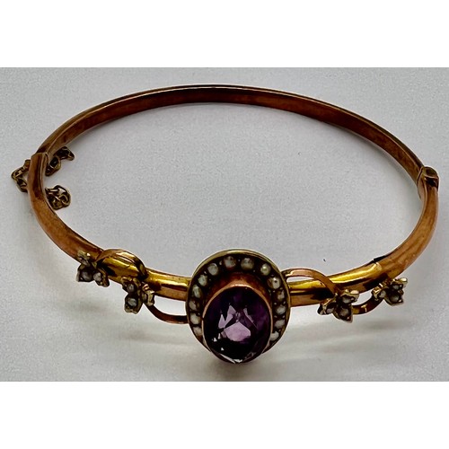 380 - Edwardian 9ct gold bangle with amethyst and seed pearls. 7gm.