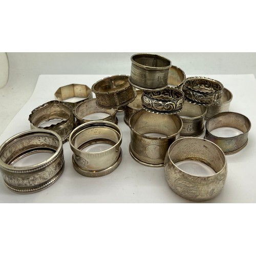 567 - Seventeen hallmarked silver napkin rings with various dates and makers. Total weight 260gm.