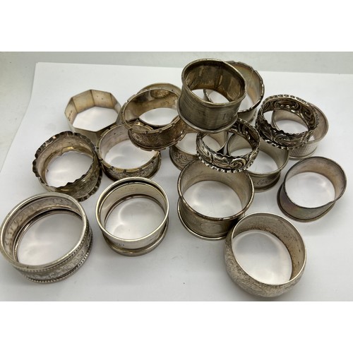 567 - Seventeen hallmarked silver napkin rings with various dates and makers. Total weight 260gm.