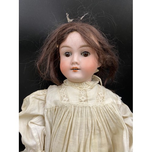 742 - A Mah Handwerok jointed German bisque Doll, marked to the back of the neck 48cms long with sleeping ... 