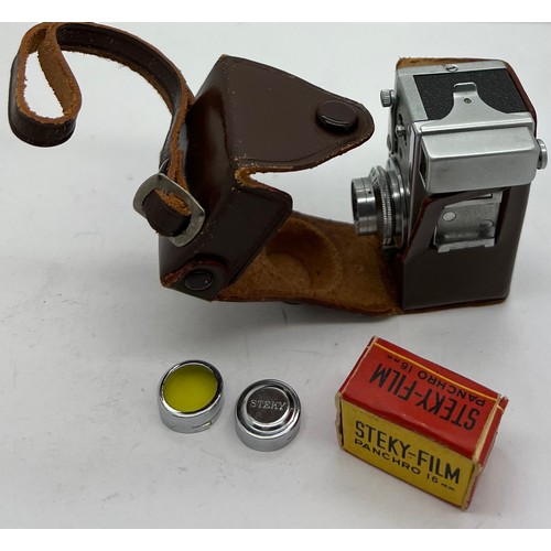 1050 - A Steky model III B vintage sub miniature film camera and case, lens cover, lens and Steky 16mm film... 