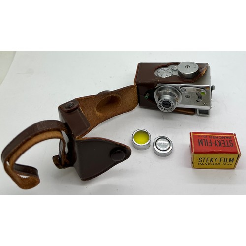 1050 - A Steky model III B vintage sub miniature film camera and case, lens cover, lens and Steky 16mm film... 