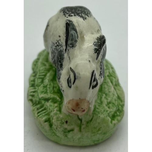 125 - A 19thC Staffordshire rabbit with sponge work decoration, 7.5cm l.