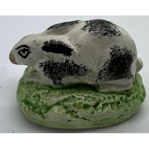 125 - A 19thC Staffordshire rabbit with sponge work decoration, 7.5cm l.