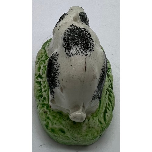 125 - A 19thC Staffordshire rabbit with sponge work decoration, 7.5cm l.