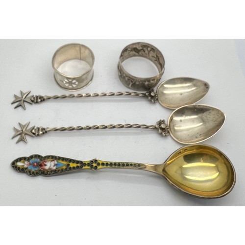 573 - Russian silver enamel spoon together with two spoons and two napkin rings. 150gm total weight.