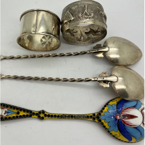 573 - Russian silver enamel spoon together with two spoons and two napkin rings. 150gm total weight.