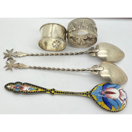 573 - Russian silver enamel spoon together with two spoons and two napkin rings. 150gm total weight.