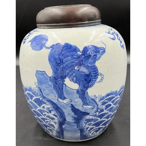 133 - A Chinese porcelain blue and white ginger jar 22cm h with carved hardwood cover, possibly Kangxi.