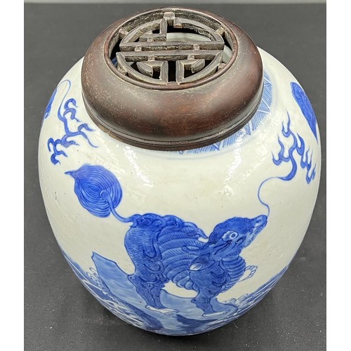 133 - A Chinese porcelain blue and white ginger jar 22cm h with carved hardwood cover, possibly Kangxi.