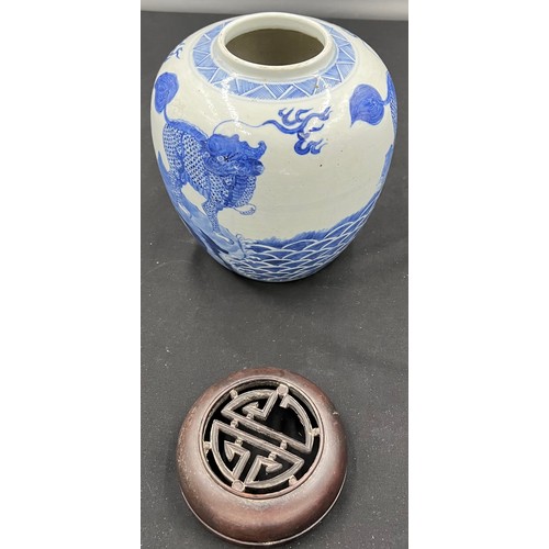 133 - A Chinese porcelain blue and white ginger jar 22cm h with carved hardwood cover, possibly Kangxi.