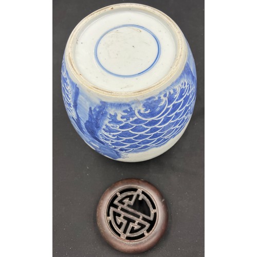 133 - A Chinese porcelain blue and white ginger jar 22cm h with carved hardwood cover, possibly Kangxi.