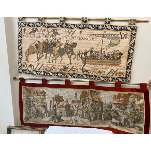 504 - Two wall hangings in the style of Bayeux tapestry including border 60cm h x 133cm, French scene 57cm... 