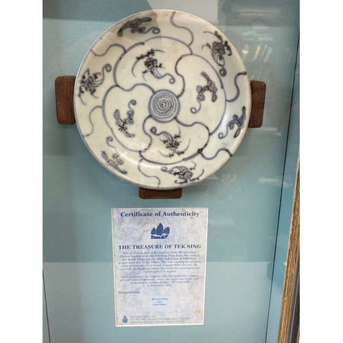 139 - The Treasure of Tek Sing Blue and White Dish Lotus Pattern with certificate of authenticity. Framed.