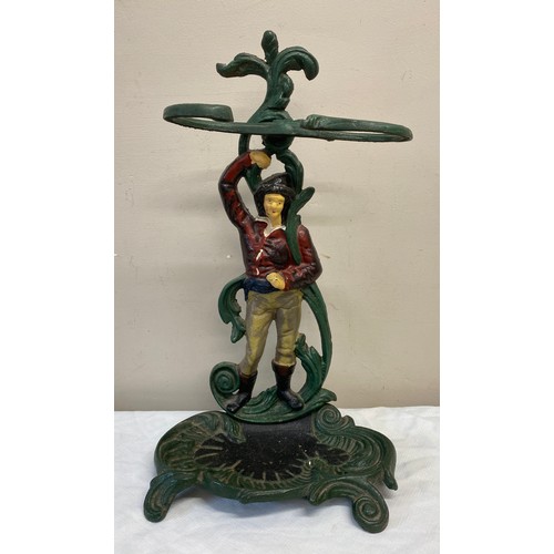 1054 - A cast iron painted umbrella/stick stand. With figure of gentleman to centre. 55cm  h x 31cm w.