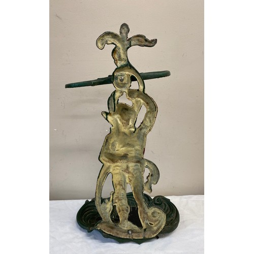 1054 - A cast iron painted umbrella/stick stand. With figure of gentleman to centre. 55cm  h x 31cm w.