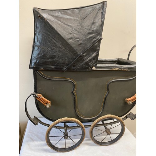 1057 - A vintage dolls pram.