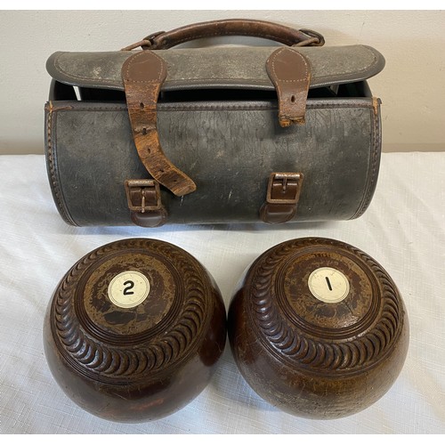 1058 - Taylor bowling balls with initials P.B to each and inscribed Watson. With case.