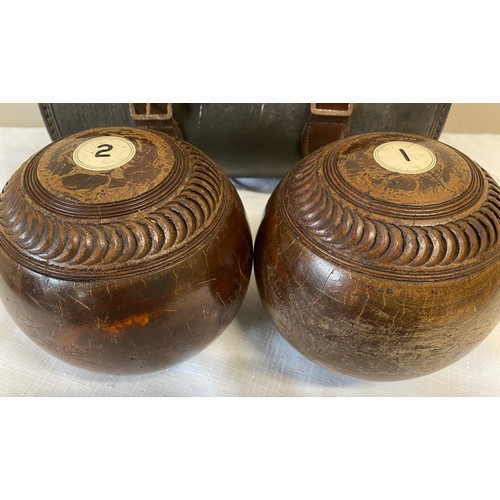 1058 - Taylor bowling balls with initials P.B to each and inscribed Watson. With case.