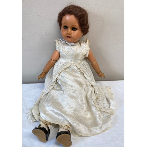 746 - A Belgium jointed wooden doll numbered 68 to head with sleeping eyes, 62cm l.