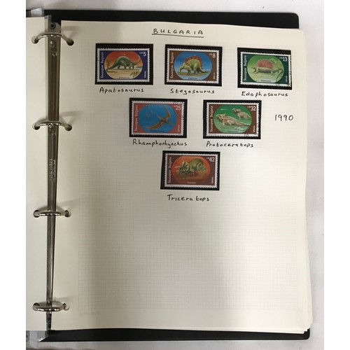 441 - Collection of Dinosaur Themetic stamps of the World including two books on the subject. Also include... 