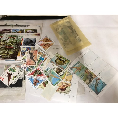 441 - Collection of Dinosaur Themetic stamps of the World including two books on the subject. Also include... 