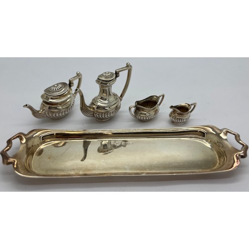 579 - Miniature silver tea service on tray, London 1976, maker Da-mar Silverware. 65gm total weight. Tray ... 