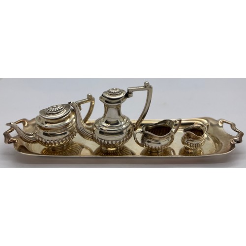 579 - Miniature silver tea service on tray, London 1976, maker Da-mar Silverware. 65gm total weight. Tray ... 