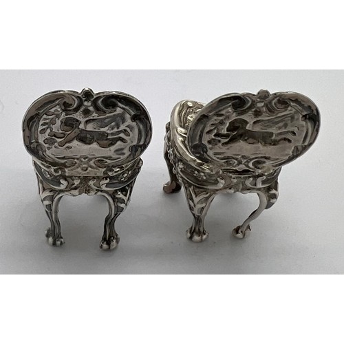 580 - A pair of miniature silver chairs. Birmingham 1902, maker Levi & Salaman. 4cm h.