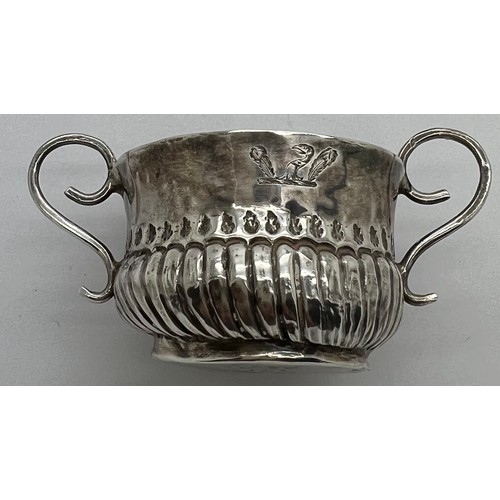 592 - A Queen Anne miniature porringer 4cm d x 3cm h with spiral fluting and wirework handles, London 1707... 