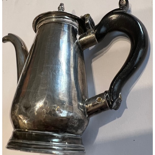 595 - Miniature silver coffee pot circa 1740, maker J.S. 7cm h with ebony handle.