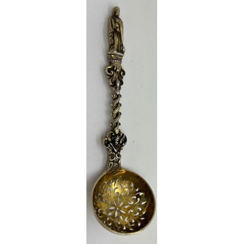 596 - A Victorian cast silver parcel gilt Apostle sifting spoon, 16cm l, weight 75gm. London 1872, maker H... 